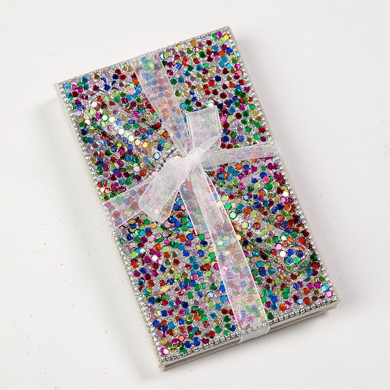 This sparkling notebook and pen set is elegant and irresistible. It is a fun gift and a great stocking filler.